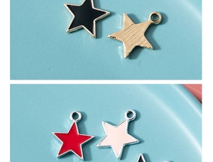 Close-up of star-shaped alloy pendants with colorful enamel drip oil finish for DIY jewelry