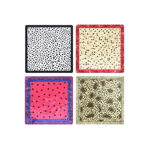 Set of four stylish square silk scarves with polka dots, floral, and leopard prints