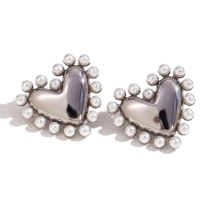 Silver heart earrings with white pearl border detail in polished stainless steel