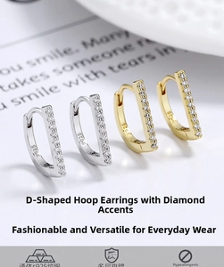 Detailed macro view of S925 sterling silver D-shaped earrings with pavé set zircon stones