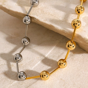 Two-tone gold and silver beaded stainless steel chain necklace with geometric bars