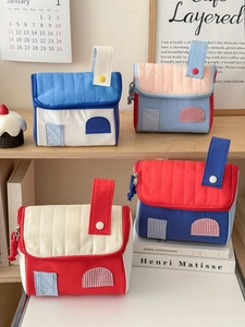 Quilted house-shaped cosmetic bags with top handles in vibrant dopamine colors