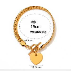 Detailed view of golden snake chain bracelet with OT clasp and heart pendant specifications