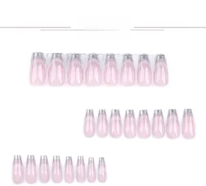 Detail of nude pink gradient coffin press-on nails with silver metallic edges and fine glitter