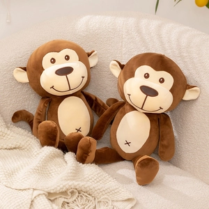 Cute brown monkey plush toy with cream belly sitting on a cozy sofa in home setting