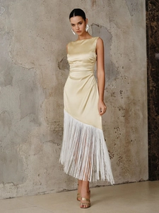 Elegant champagne satin sleeveless dress featuring asymmetrical white fringe hem