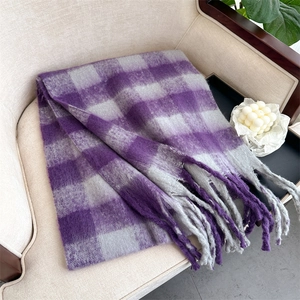 Close-up of purple and grey checkered scarf with soft texture and stylish long tassels