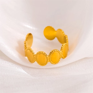 Vintage oval beaded edge gold stainless steel open ring on soft white silk background
