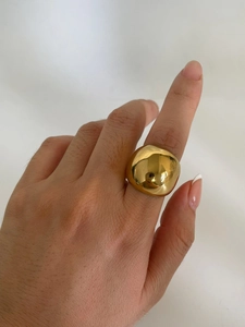 Close-up of a high-quality 18K gold plated stainless steel dome ring worn on finger