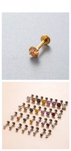 Detail of titanium labret studs with champagne zircon and various gem sizes 3mm to 6mm