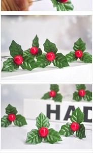 Detailed view of artificial red berries and green holly leaves for Christmas DIY decor