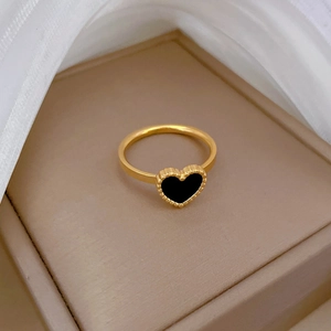 Elegant gold-plated heart ring with black enamel inlay and beaded edge in a gift box
