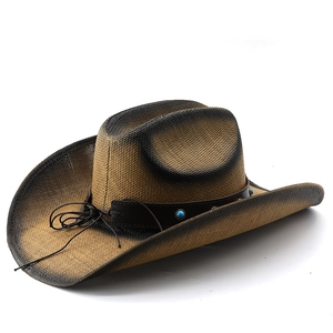 Close-up of two-tone straw cowboy hat with turquoise beads on a leather band