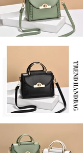 Detailed close-up of textured leather handbags with metal handles and woven side decor