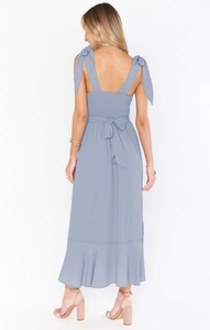 Detail of smocked back and shoulder ties on this elegant light blue maxi dress