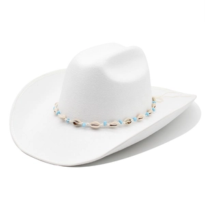 White wide brim felt cowboy hat with ethnic shell and blue bead trim on white background