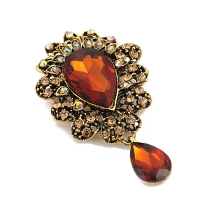 Vintage style drop brooch with amber crystal and champagne rhinestones in gold finish