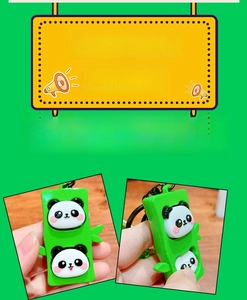Detail of green panda bamboo stress relief keychain with a dual panda head design