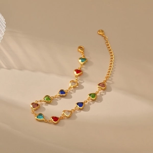 Fashionable gold-plated bracelet featuring multi-colored crystal heart charms with lobster clasp