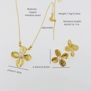 Elegant four-petal flower jewelry set with gold snake chain, earrings, and imitation pearls