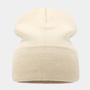 Creamy white ribbed knit beanie for winter featuring a minimalist cuff and warm stretch fabric