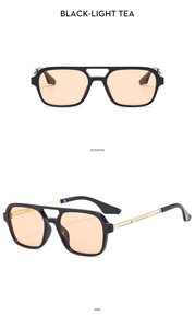 Retro aviator sunglasses featuring a black double-bridge frame and light tea lenses