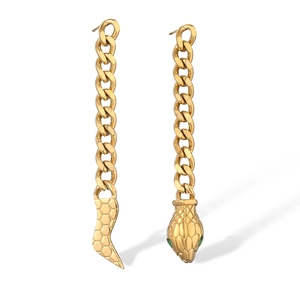 Detail of 18K gold-plated snake earrings with green eyes and scale texture