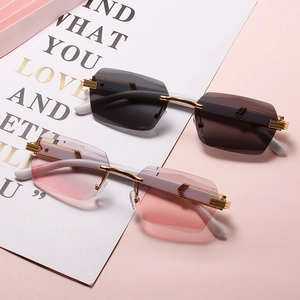 Frameless gradient sunglasses with gold metal temples in black and pink lens styles