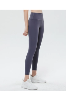 Close-up of high-waisted yoga pants in dark grey-purple showing butt-lifting fit