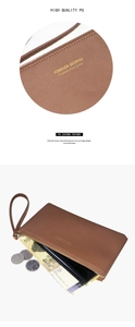 Detail of brown PU leather wallet with gold lettering and durable metal zipper strap