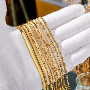 18K gold plated stainless steel chunky chain bracelet set held in white gloves