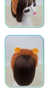Detail of plush orange lion ear headband with soft faux fur texture for Halloween