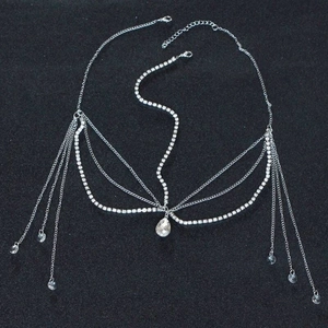 Detail of silver forehead chain with crystal tassels and teardrop pendant in layered design