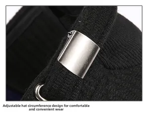 Detail of adjustable metal buckle and black knitted fabric on winter flat top cap