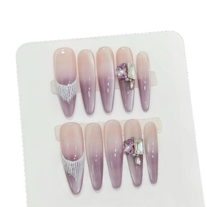 Taro purple gradient press-on nails with 3D floral accents and shimmering stiletto tips