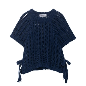 Detail of navy blue hollow knit top featuring chunky texture and side drawstring ties