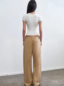 Rear view of fitted white short sleeve T-shirt and khaki wide-leg twill cotton trousers