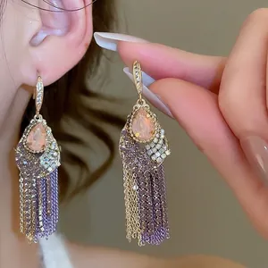 Vintage boho earrings with pink pear-cut zircon and long multicolor tassel chains