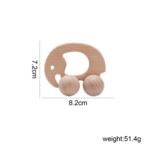 Detail shot of walnut wood elephant toy with dimensions 7.2cm by 8.2cm and weight 51.4g