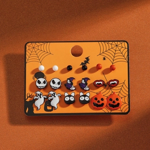 Detail of Halloween stud earring set with pumpkin, ghost, and cat motifs in enamel finish