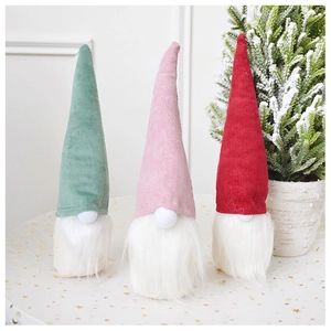 Detailed close-up of three colorful velvet Christmas gnomes with long faux fur beards