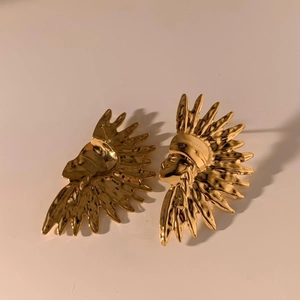 Golden stainless steel stud earrings featuring a unique Indian chief portrait design