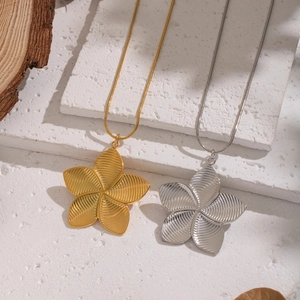 French vintage floral pendant necklaces in gold and silver steel with petal texture