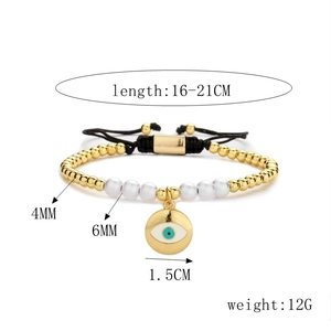 Detail of adjustable evil eye bead bracelet with gold accents and woven cord closure