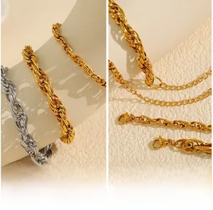 Detailed macro view of gold and silver twisted rope chains with lobster clasp closure
