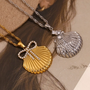Detail of shell pendants with crystal bow and starfish on twisted chains