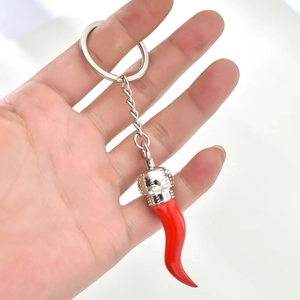 Creative red chili horn pendant keychain in polished metal with silver crown accent