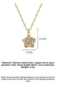 Detailed view of gold titanium steel five-petal flower necklace with micro-pave zircons