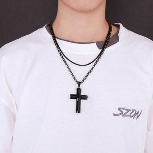 Double-layered black stainless steel cross necklace with hip hop style chain on model
