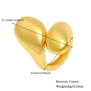 Detail view of golden copper ring showing dimensions 31.5mm by 23mm and 8g weight